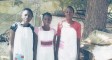 Girls from Nigeria wearing the pillowcase dresses they received.