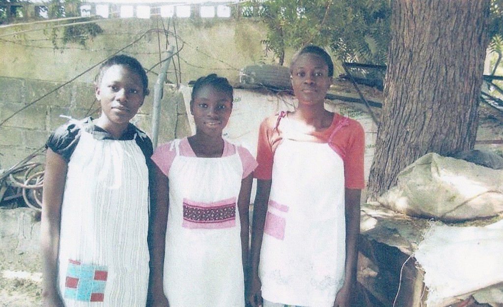 Girls from Nigeria wearing the pillowcase dresses they received from Faith Lutheran in 2011.