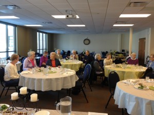 Leaders sat at a head table to represent a family - parents and child - and their roles at a Seder meal.