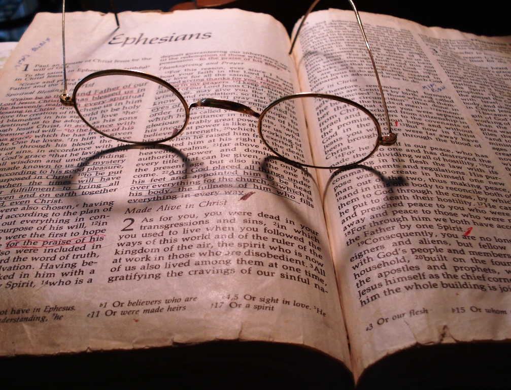 Open Bible with Eye Glasses
